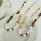 Greta Pearl Necklace detail view styled for Avrienne