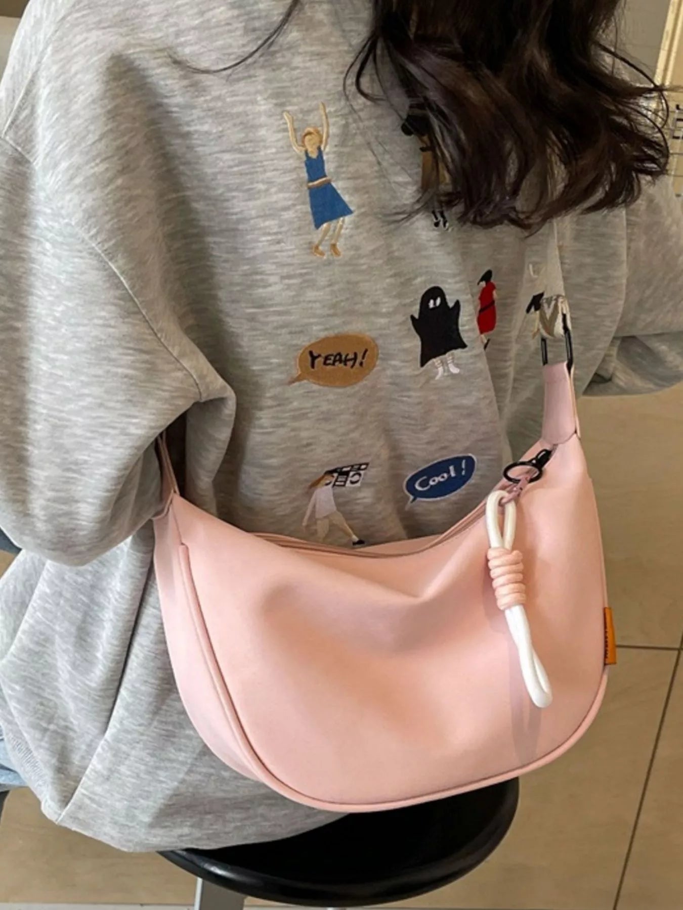 Amalia Straw Crossbody detail view styled for Avrienne