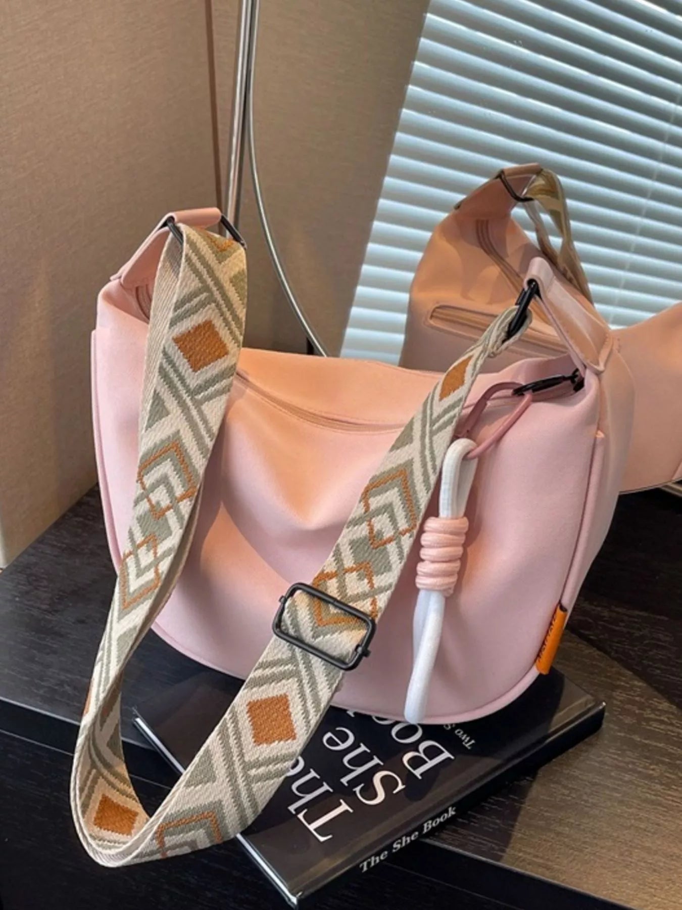 Amalia Straw Crossbody detail view styled for Avrienne