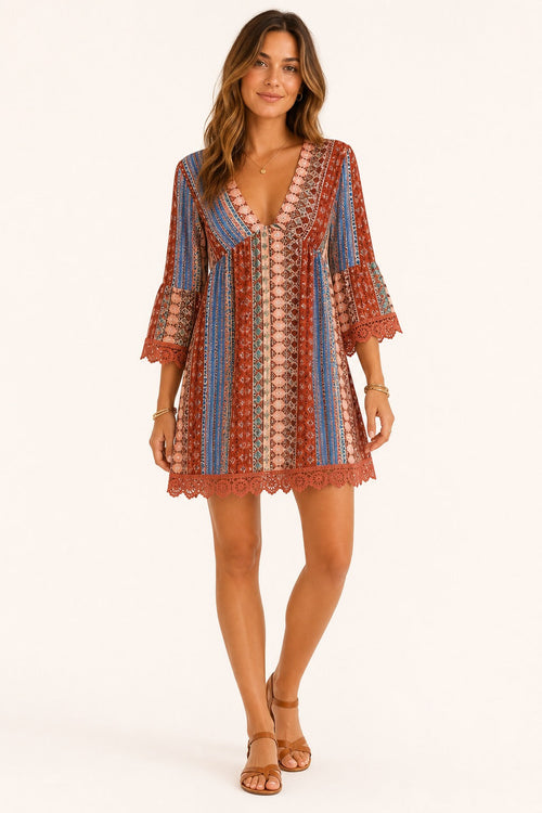 Adeline Lace V-Neck Dress in Rust front view on a model for Avrienne