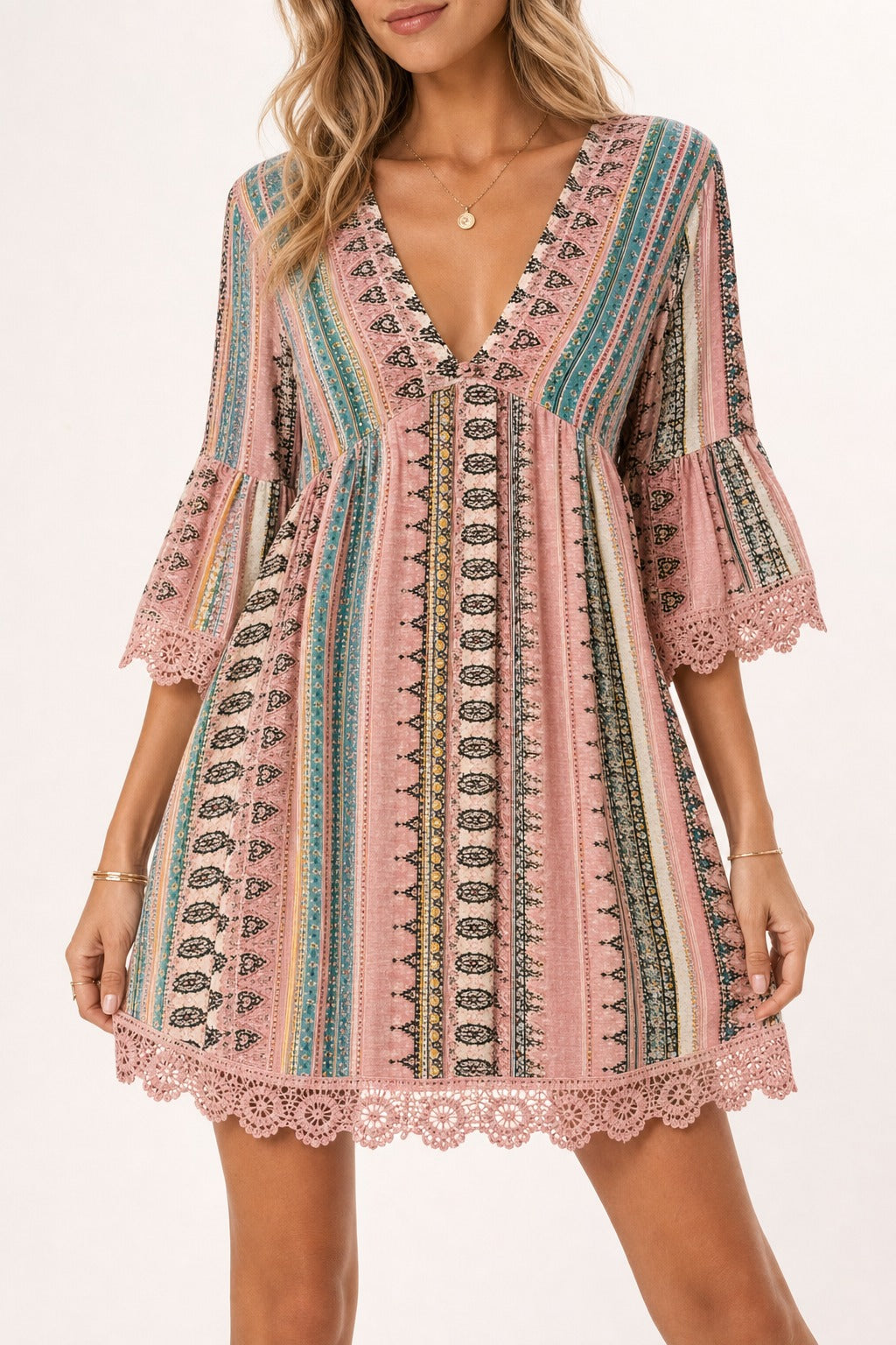 Adeline Lace V-Neck Dress in Blush Pink detail view on a model showing the V neckline and lace trim