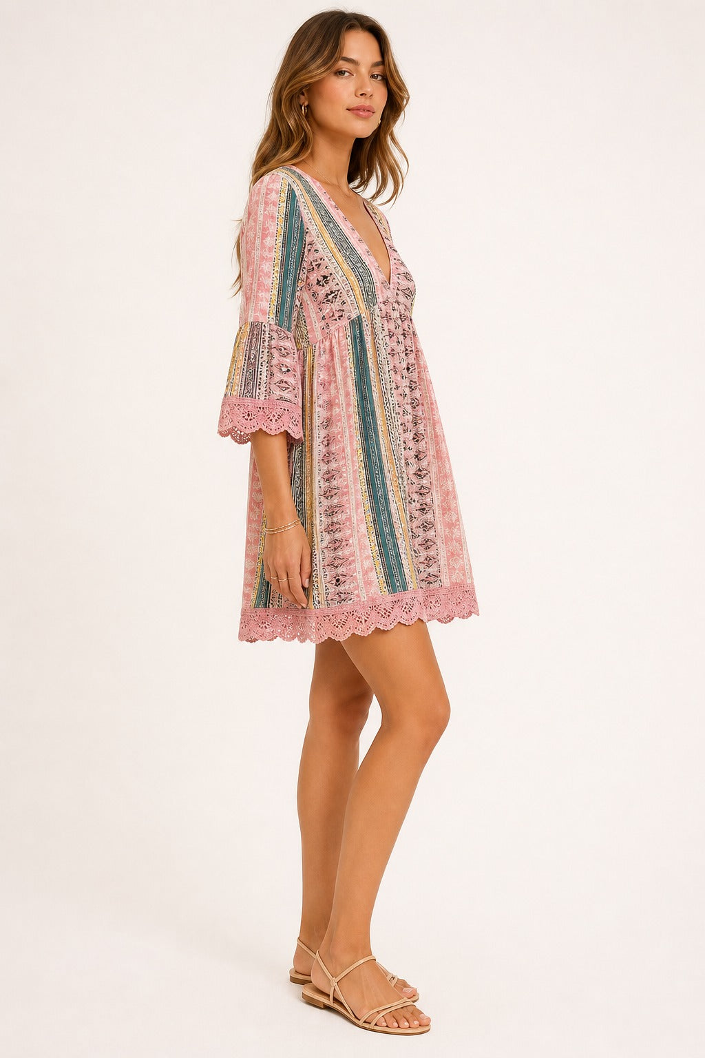 Adeline Lace V-Neck Dress in Blush Pink side view on a model showing sleeve and hem lace trim