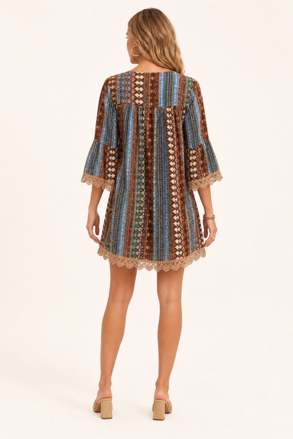 Adeline Lace V-Neck Dress in Brown back view on a model showing the back yoke, vertical print, and lace hem