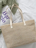 Yara Woven Tote detail view styled for Avrienne