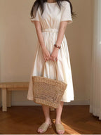 Viola Woven Bag detail view styled for Avrienne