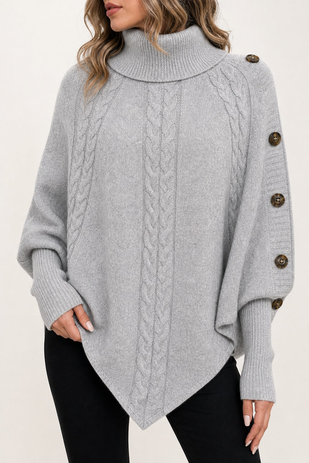 Florence Cable Cape Sweater in gray detail view showing ribbed turtleneck, cable knit texture, cuffs, and tortoise buttons