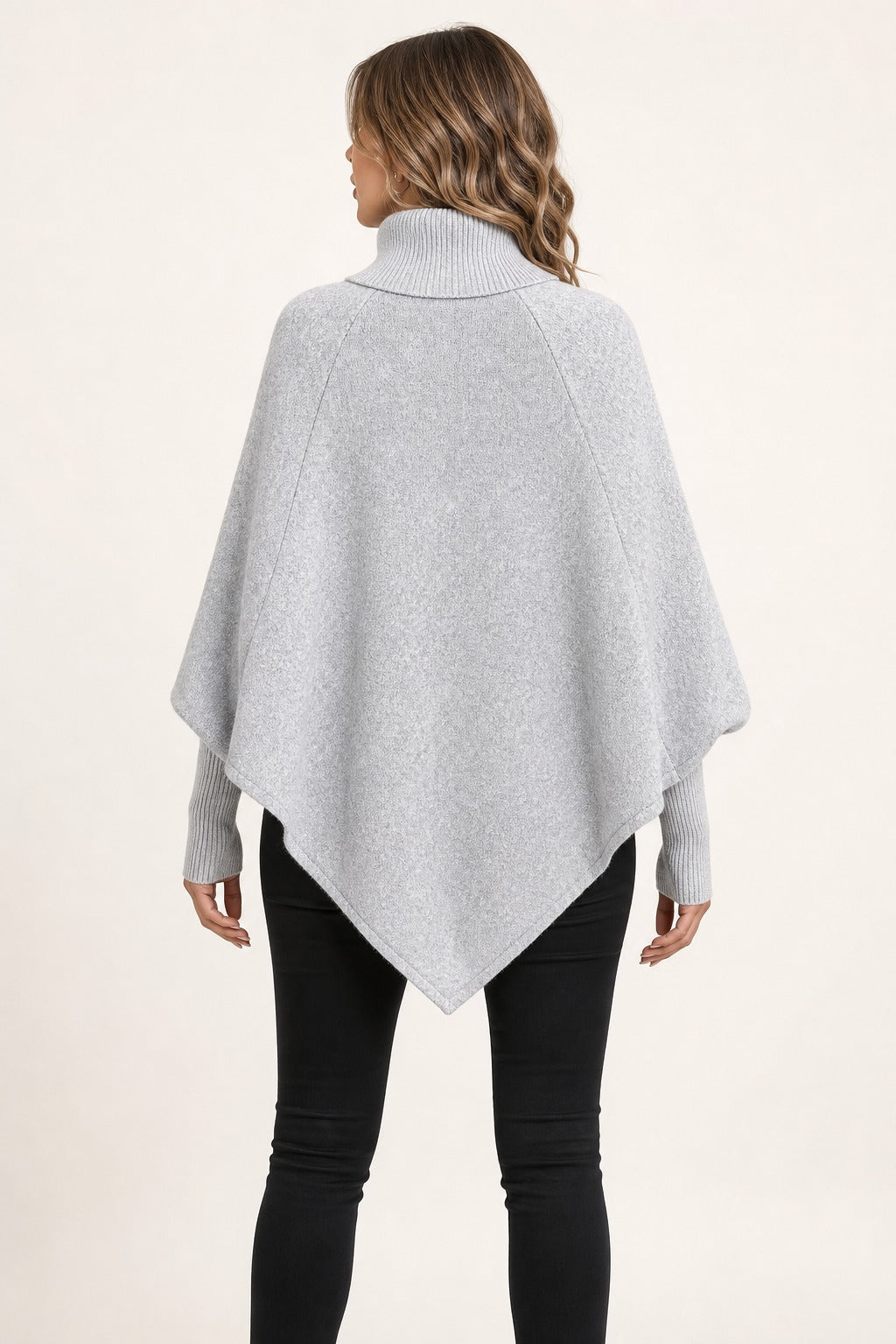 Florence Cable Cape Sweater in gray back view showing the high ribbed collar, cape drape, and pointed back hem